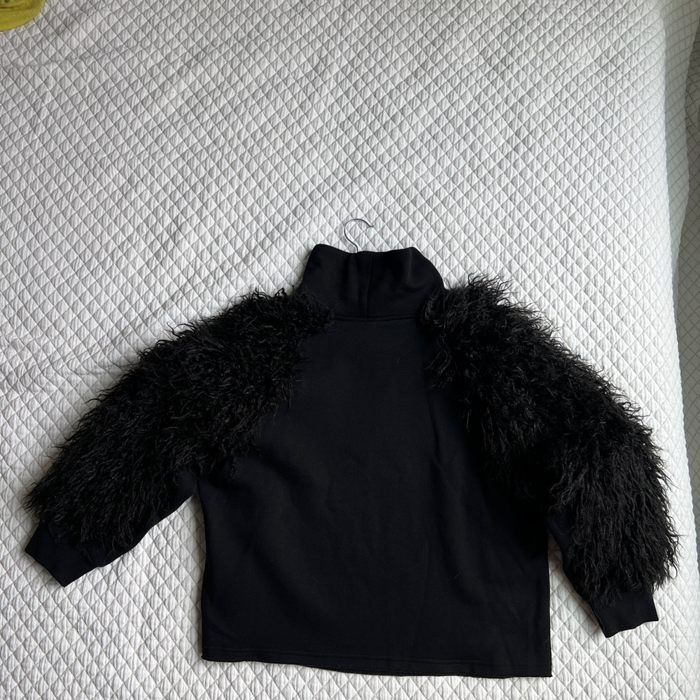 Chic Black Turtleneck with Fuzzy Sleeves